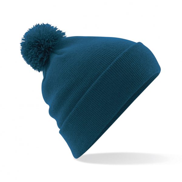 This original double layer knit cuffed design Pom Pom Beanie comes in a wide range of colours. Your logo or name can be custom embroidered on the front of this self coloured Pom Pom, ensuring that your logo stands out from the crowd! This branded pom pom is a must for inclusion in your Autumn/winter workwear/uniform or club gear collection!